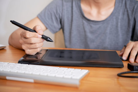 Man with tablet drawingの写真素材