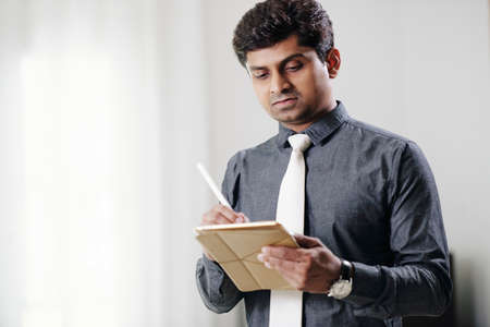 Businessman working on tablet computerの写真素材