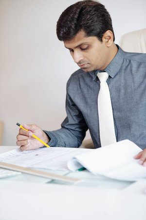 Manager checking construction plan