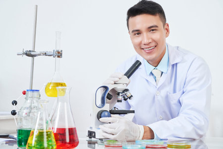Cheerful Vietnamese chemist