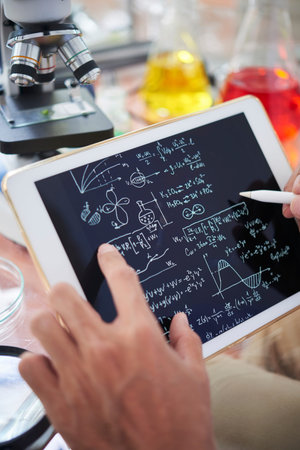 Chemist taking notes
