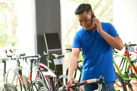 Choosing bicycle in storeの写真素材
