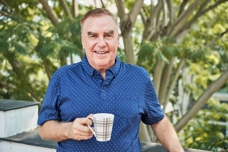 Positive man with tea cup