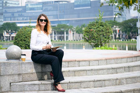 Business lady working outdoorsの写真素材