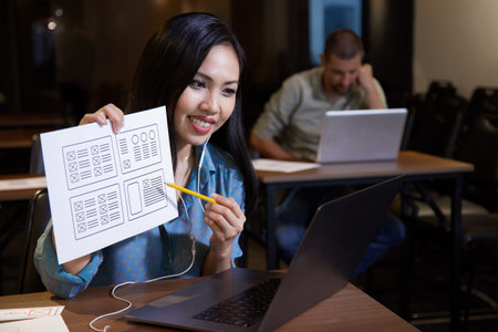 Business lady showing design template when video calling