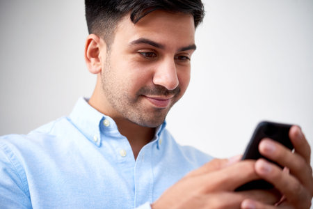 Texting smiling man