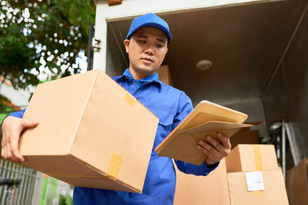 Courier reading addressの写真素材