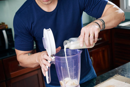 Making banana smoothie with milk