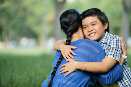 Boy embracing his mother