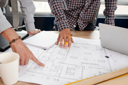 Building blueprint in tablet of construction engineers