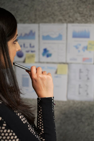 Businesswoman analzying financial statistics