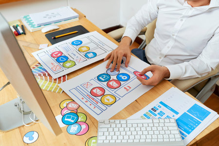 UI designer choosing best icons for the mobile application he is working on