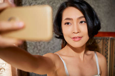 Beautiful woman taking selfieの写真素材