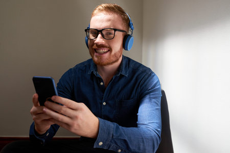 Portrait of cheerful man with smartphone