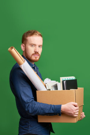 Employee with box of belonging