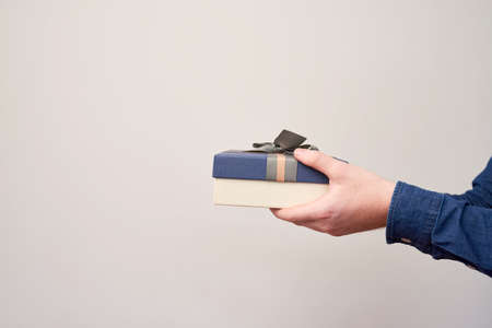 Man holding small presentの写真素材