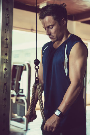 Man doing triceps pushdown
