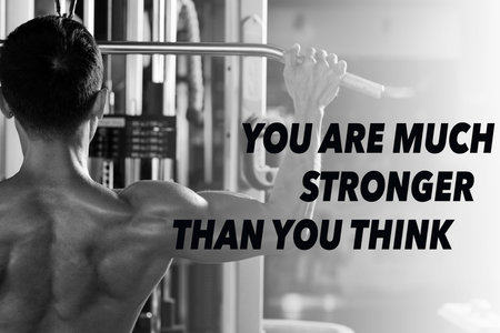 Rear view of strong man doing exercise on fly machine, you are much stronger that you think...