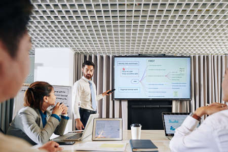 Young serious businessman suggesting his plan of business development during financial crisisの写真素材