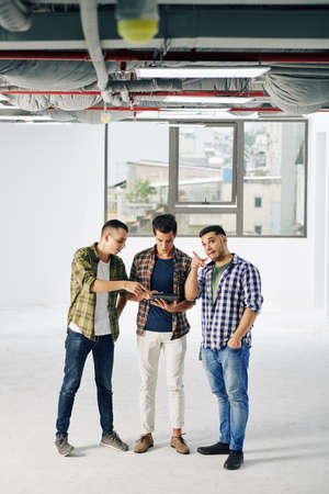 Industrial building owners discussing how to do interior worksの写真素材