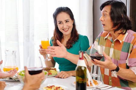 Asian couple telling exciting story