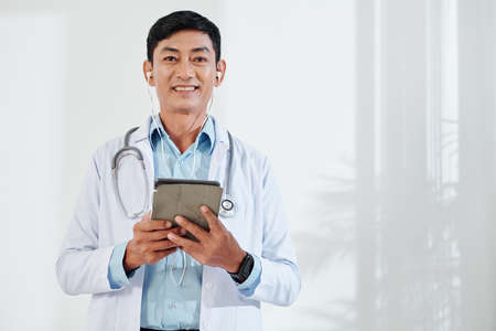 Middle-aged doctor making video callの写真素材