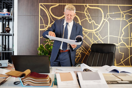 Man checking engineering documents