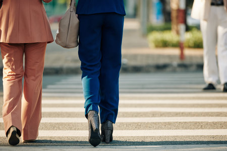 Businesswomen crossing roadの写真素材