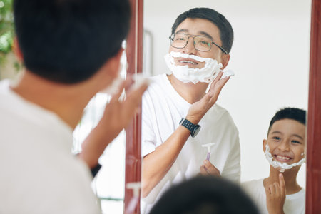 Shaving father and sonの写真素材