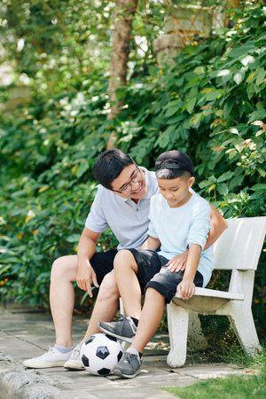 Resting after playing soccerの写真素材