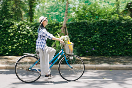 Happy woman riding bicycle