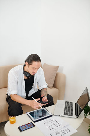 Interior designer checking phone
