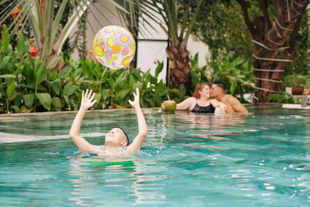 Boy playing in swimming pool