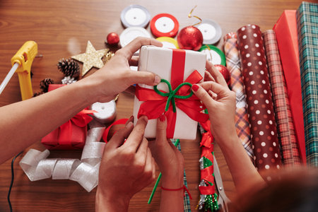 Decorating gift with bowsの写真素材