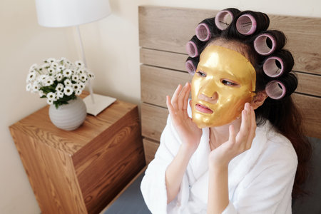 Woman applying silicone sheet maskの写真素材