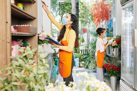 Florists preparing for openingの写真素材