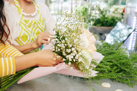 Florist making beautiful bouquetの写真素材