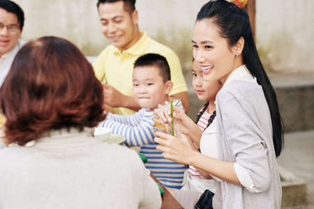 Woman talking to family membersの写真素材