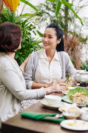 Mother and daughter having dinnerの写真素材