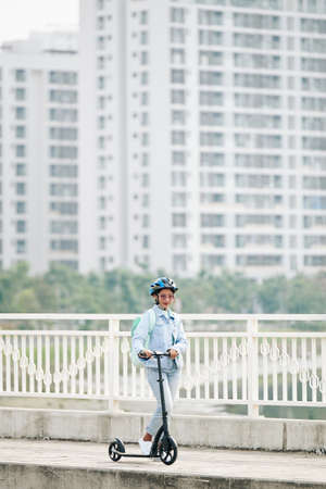 Woman riding on bridgeの写真素材