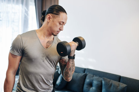 Man pumping biceps