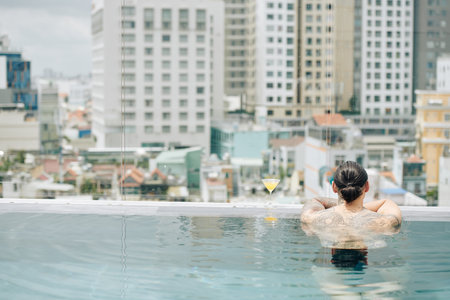 Man relaxing in swimming pool