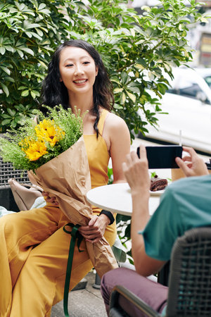 Woman posing with flowersの写真素材