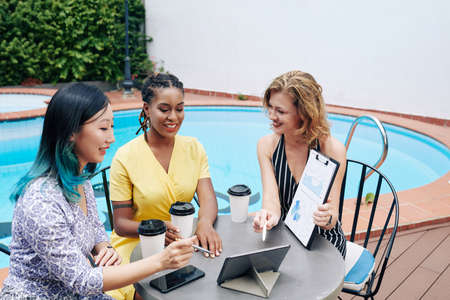 Businesswomen watching presentationの写真素材