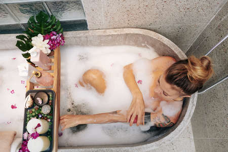 Woman washing her bodyの写真素材