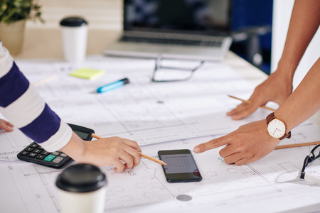 Architect and manager planning work