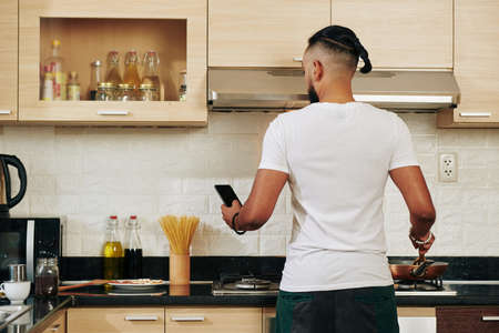 Man making breakfastの写真素材