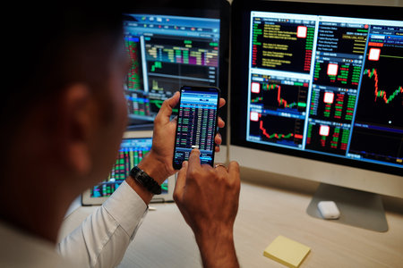 Close-up image of trader trading stocks and options in stock market. and monitoring proces via...