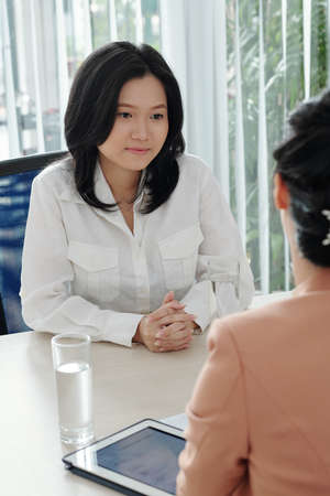 Young businesswoman attending job interview with company human resources managerの写真素材