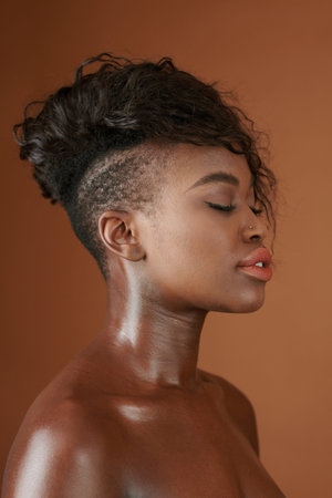 Beautiful young woman with beautiful shiny skin closing eyes and breathing in